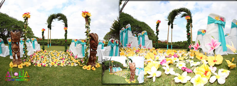 palms arch with tiki wooden Hawaiian statues at estate house wedding pink and yellow flowers